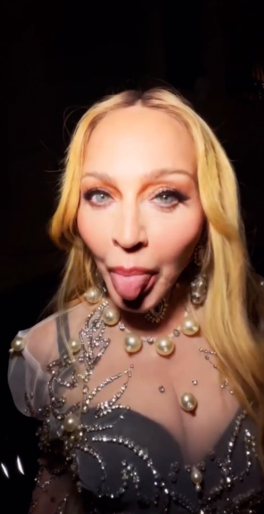 Photo of Madonna sticking her tongue out. 