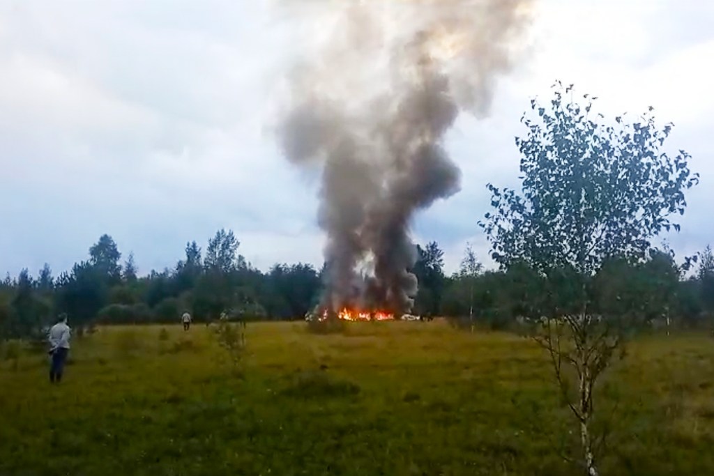 In this image from video, smoke and flames rise from a crashed private jet near the village of Kuzhenkino, Tver region, Russia, Wednesday, Aug. 23, 2023.