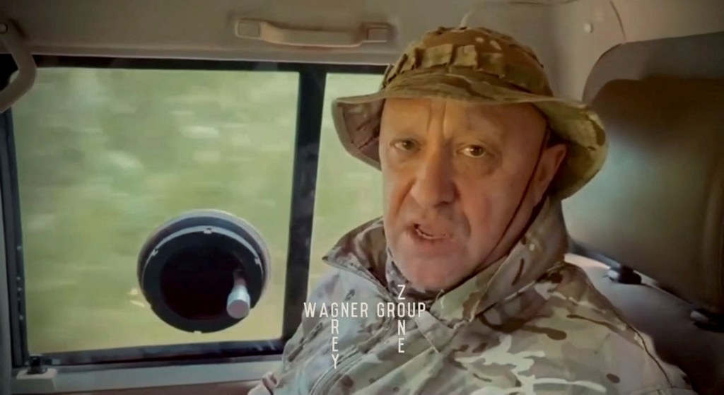 Yevgeny Prigozhin, chief of Russian private mercenary group Wagner, gives an address in camouflage inside a vehicle at an unknown location, in this still image taken from video possibly shot in Africa and published August 31, 2023. 