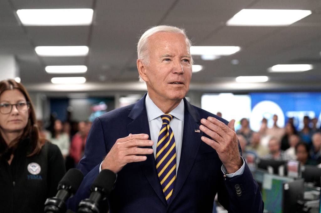 Biden is pictured talking to members of the media as he visited the Federal Emergency Management Agency on Thursday.