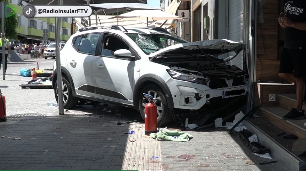 The white SUV was heavily damaged from the impact, with its windshield smashed and hood dented.