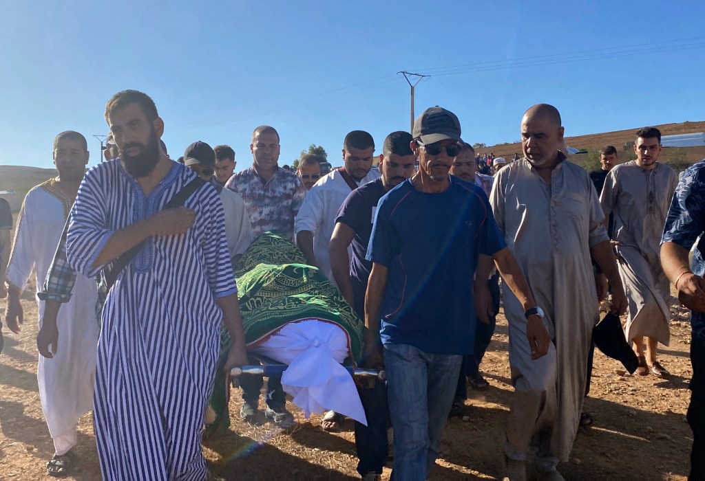 People attend the funeral of Bilal Kissi on Wednesday.