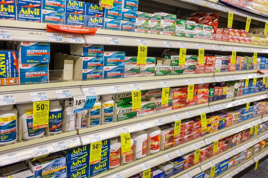 Brand name medicines on a shelf.