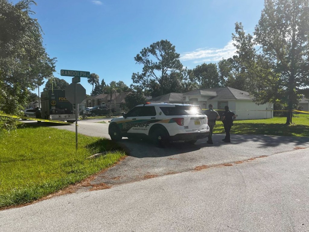 Police seen at the scene of the baby's shooting in Palm Coast