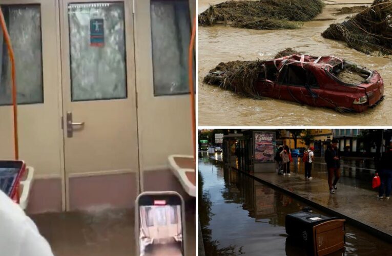 Moment Madrid commuters are caught in flooded metro