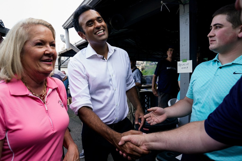 Vivek Ramaswamy shaking hands on the campaign trail. 