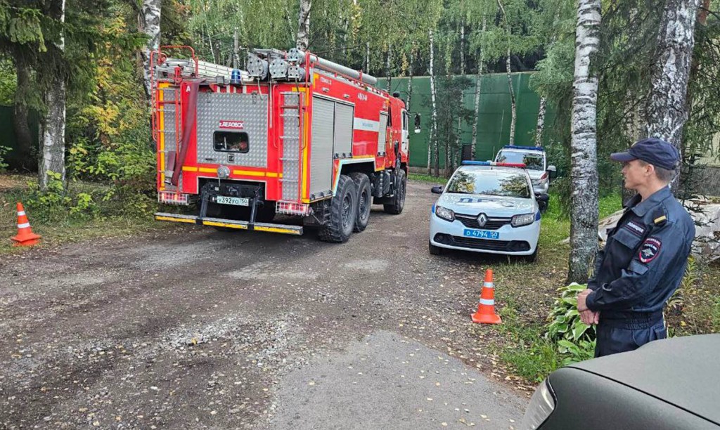 First responders seen at a site where a drone was shot down in Russia Tuesday  