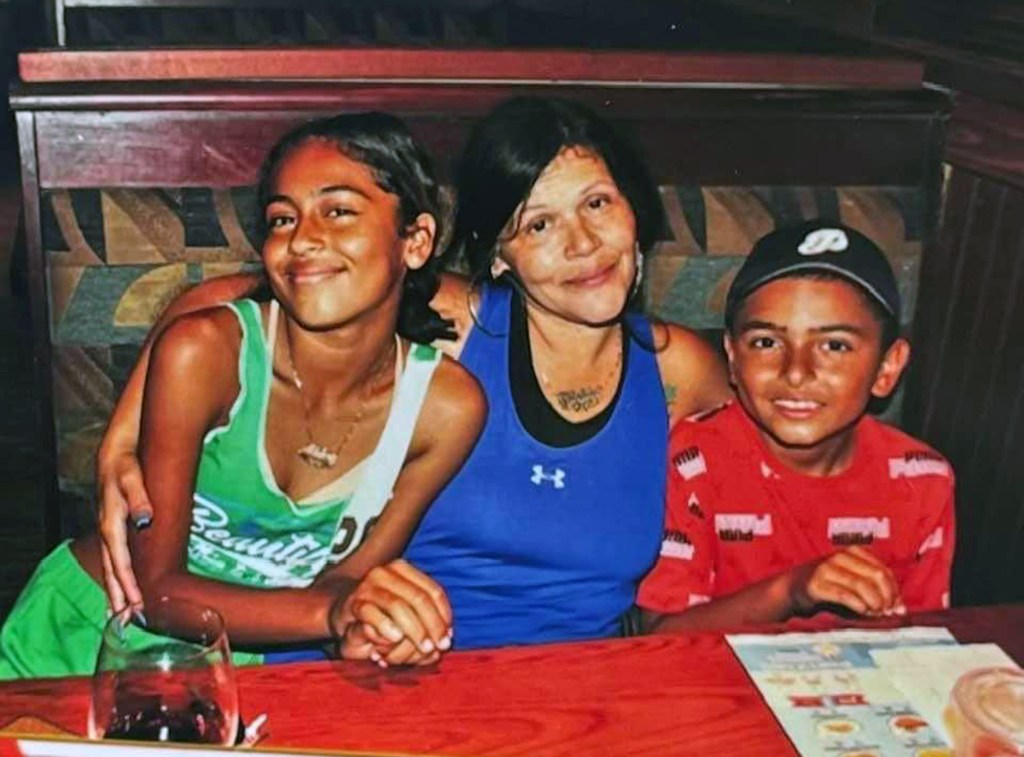 Mylie, left, and Marvin, right, seen with their grandmother Trinidad 