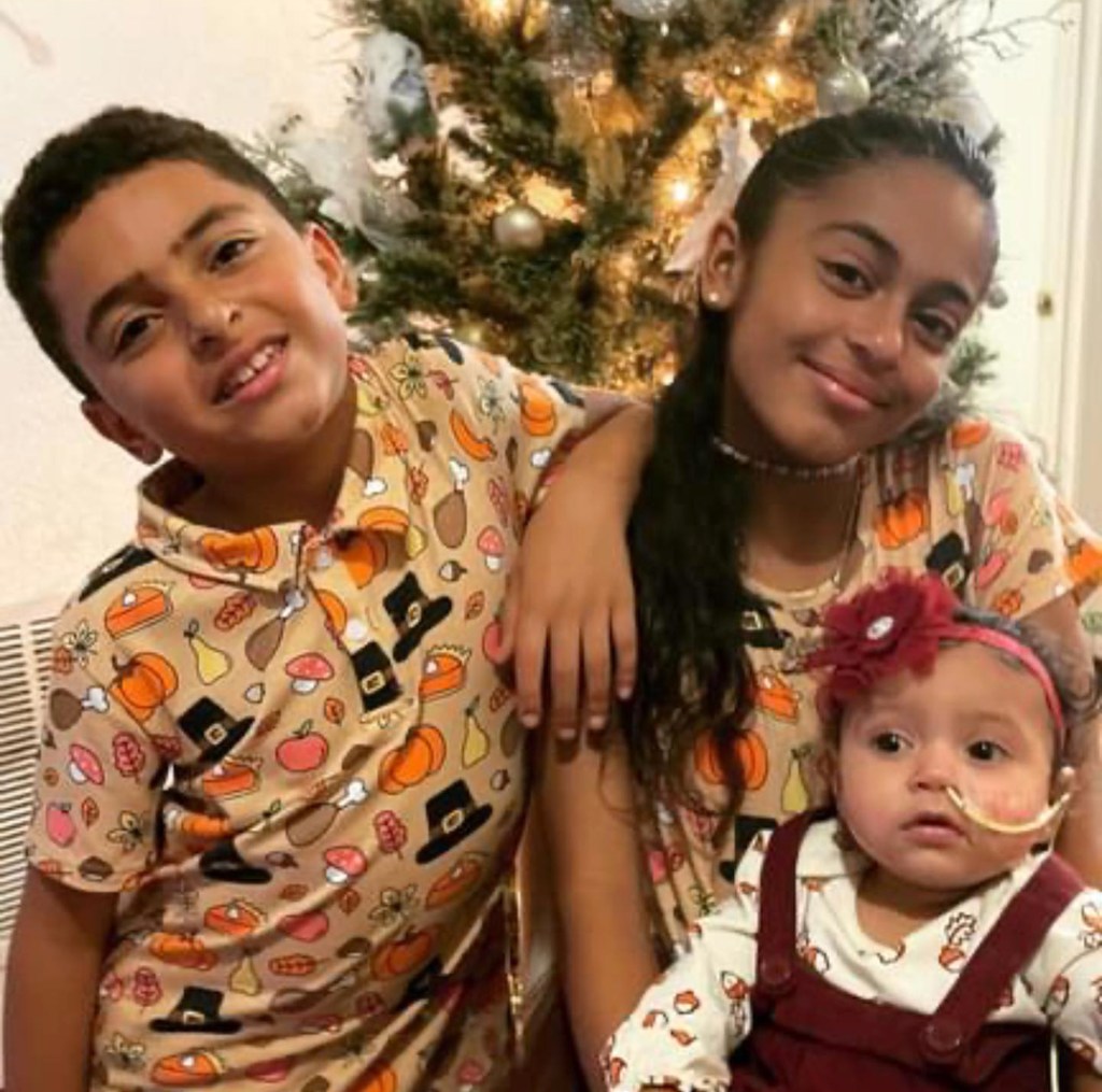 Mylie, Marvin and baby Anayari are seen in a fall-themed photo