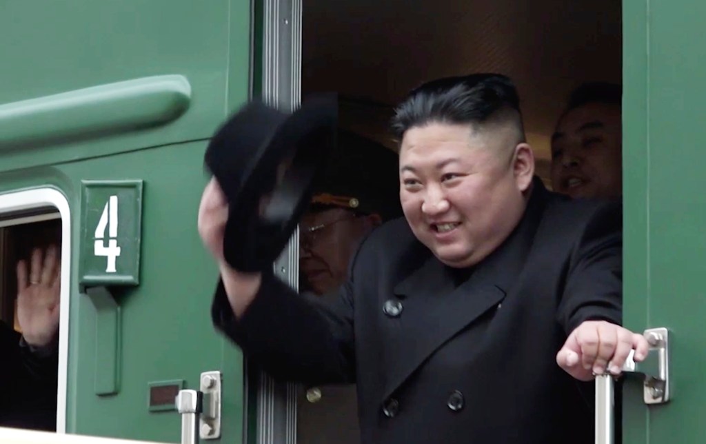Kim Jong Un waving from train