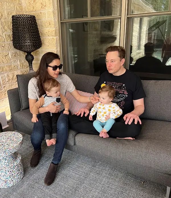 Shivon Zilis holding son Strider and Elon Musk holding daughter Azure