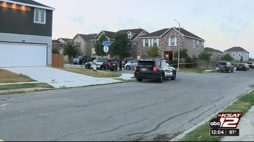 Police vehicles are pictured in the residential neighborhood.