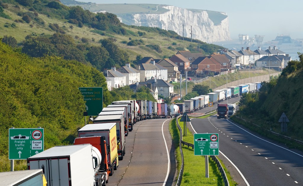 Trucks queue for the Port of Dover along the A20 in Kent as security checks are being carried out amid an ongoing effort to track down Khalife.