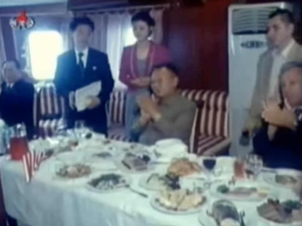 Kim Jong Il at dining table on train