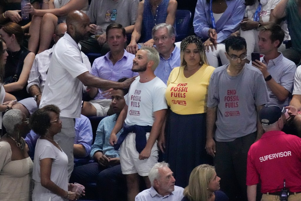 Activists stand up to interrupt the US Open