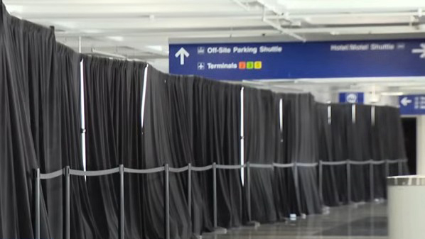 More than 400 migrants are reportedly being housed in a section of the airport, hidden from public view behind black curtains, up from 31 at the beginning of August. 