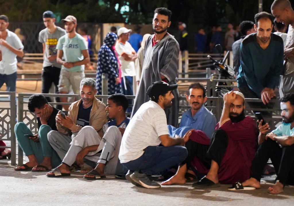 People gather on a street in Casablanca after the earthquake as they feared another one could hit the area.