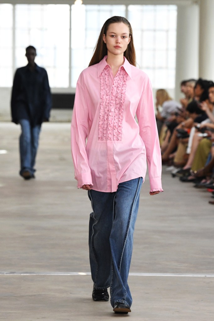 A model in a pink shirt walks the Tibi show on Saturday