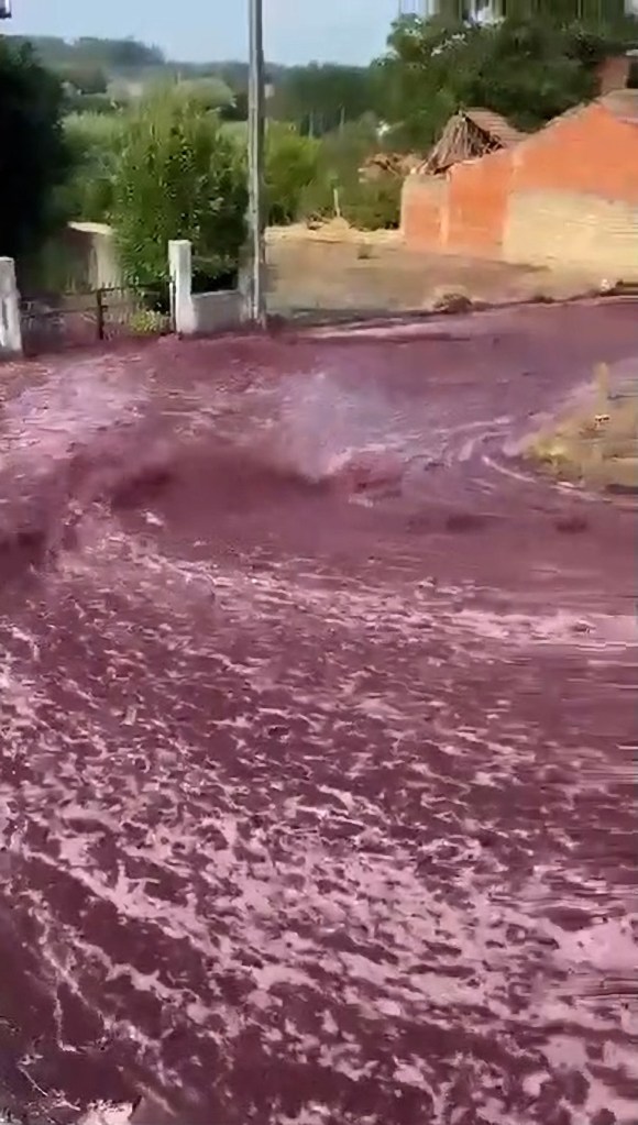A screengrab shows the wine flowing down a hill.