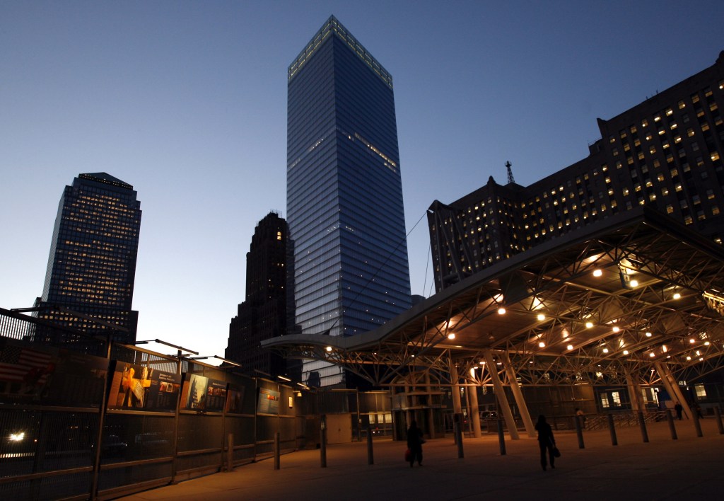 7 World Trade Center, center, the last building to collapse as a result of the World Trade Center attacks Sept. 11, 2001, and the first to be permanently rebuilt, rises above ground zero and the World Trade Center station at dusk, Monday, May 22, 2006, in New York.