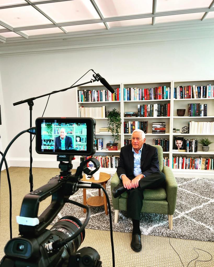 Walter Isaacson is pictured giving an interview.