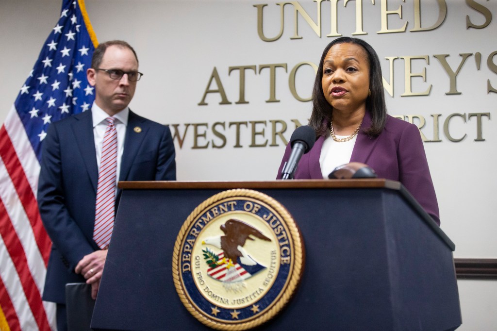 U.S. Attorney General for the Western District of Tennessee Kevin Ritz, left, looks on as Assistant U.S. Attorney General Kristen Clarke.