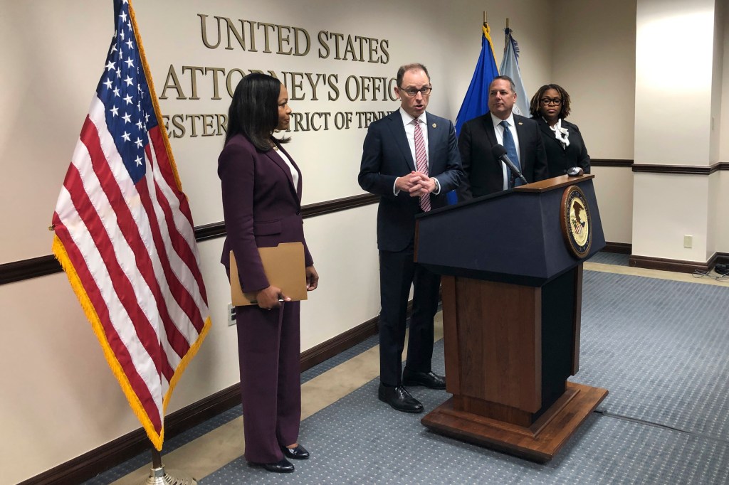 Kevin Ritz, the U.S. Attorney for the federal district in West Tennessee, center, speaks with reporters about charges filed against five former Memphis Police Department officers in connection with the violent beating and death of Tyre Nichols