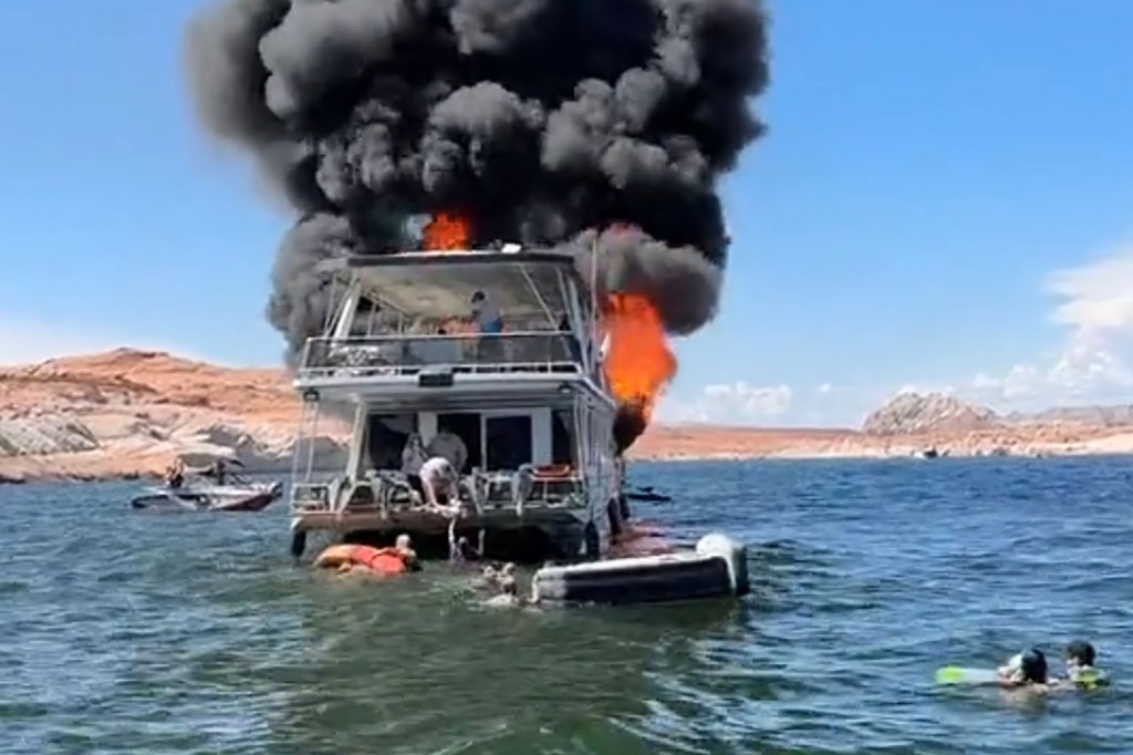 Heavy plumes of black smoke billowed from the two-story ship as other boaters raced across Lake Powell to help the family of 29 to safety.