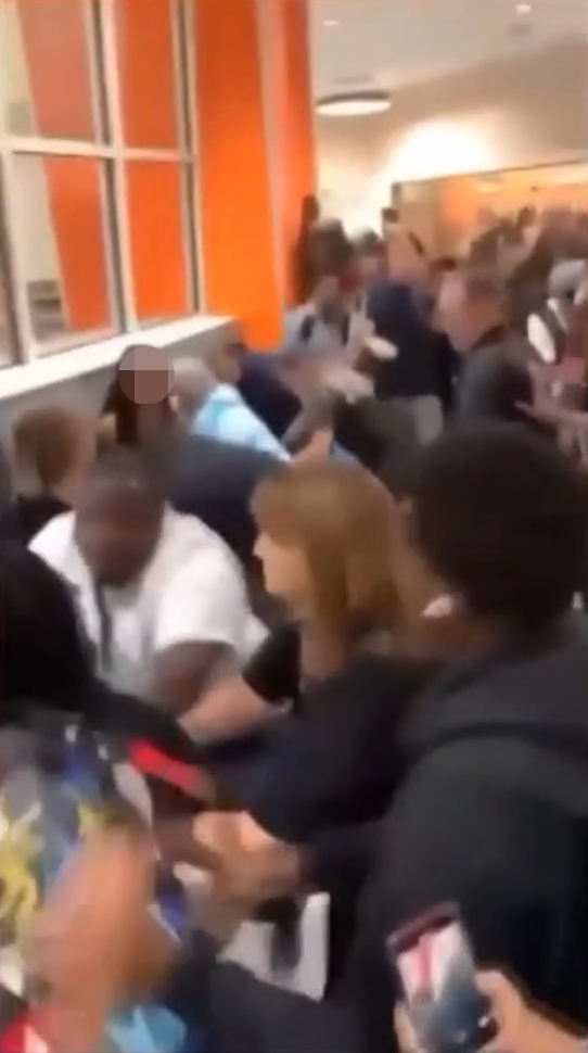 One video allegedly shows school principal Christina Stanley being thrown to the ground as she attempted to separate two students with the help of another school staffer.