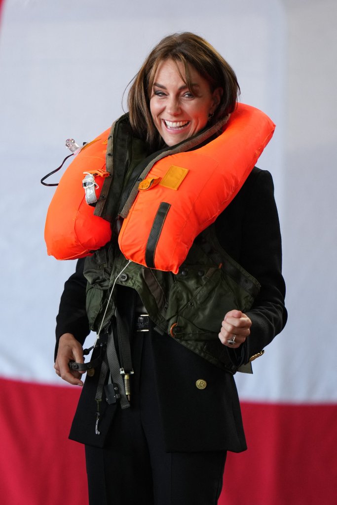 The senior royal can was then spotted giggling as she pulled the toggle to inflate the survival gear. 