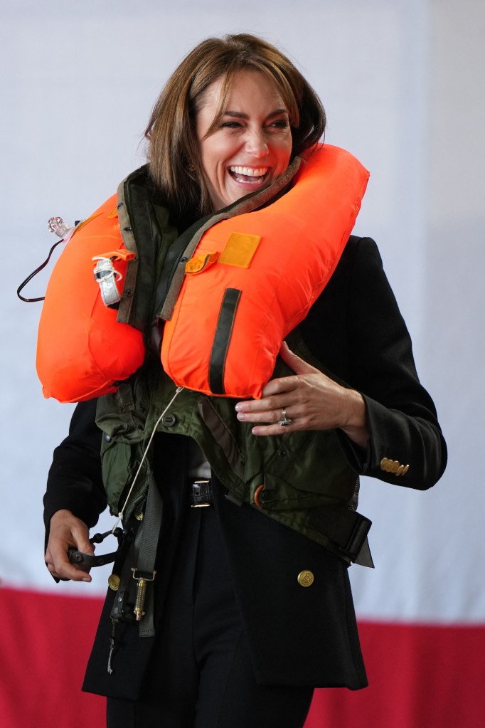 The senior royal can was then spotted giggling as she pulled the toggle to inflate the survival gear.