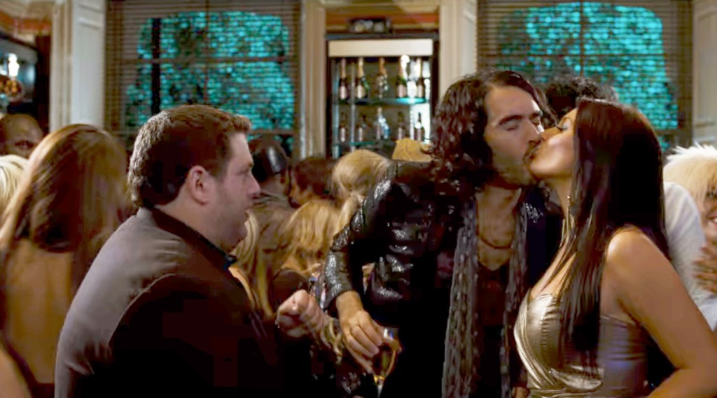 Russell Brand seen kissing a brunette in the 2010 comedy "Get Him to the Greek."  