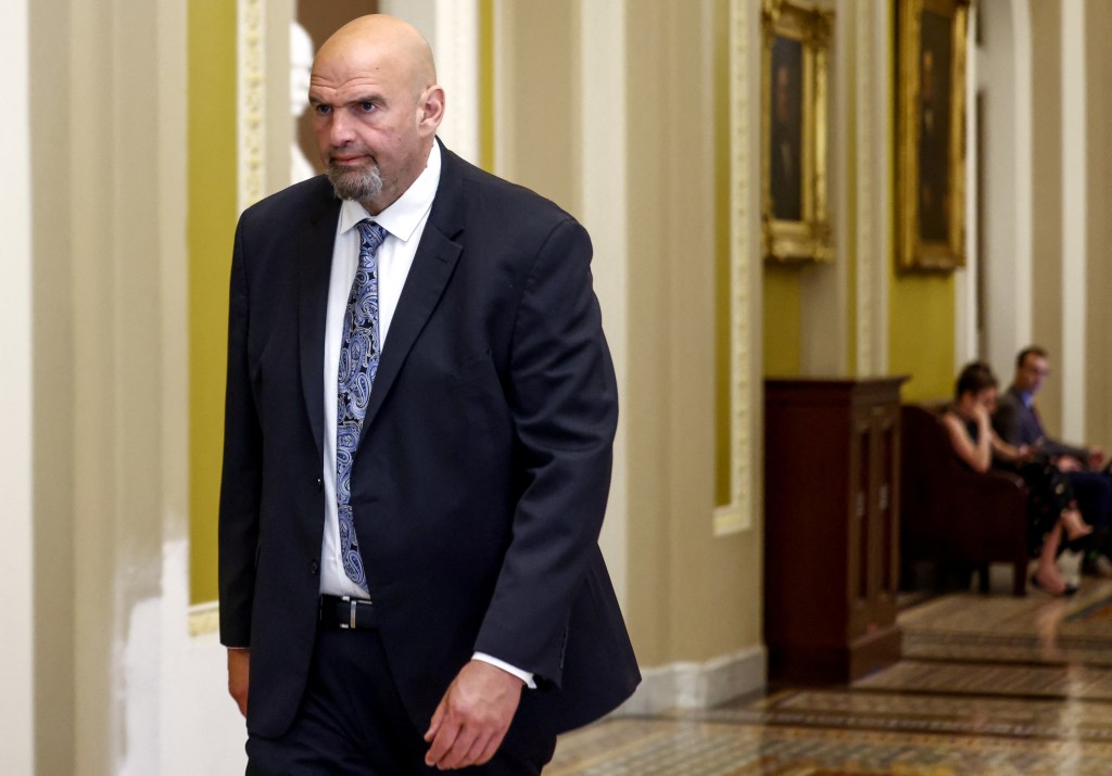 John Fetterman is pictured in a suit 