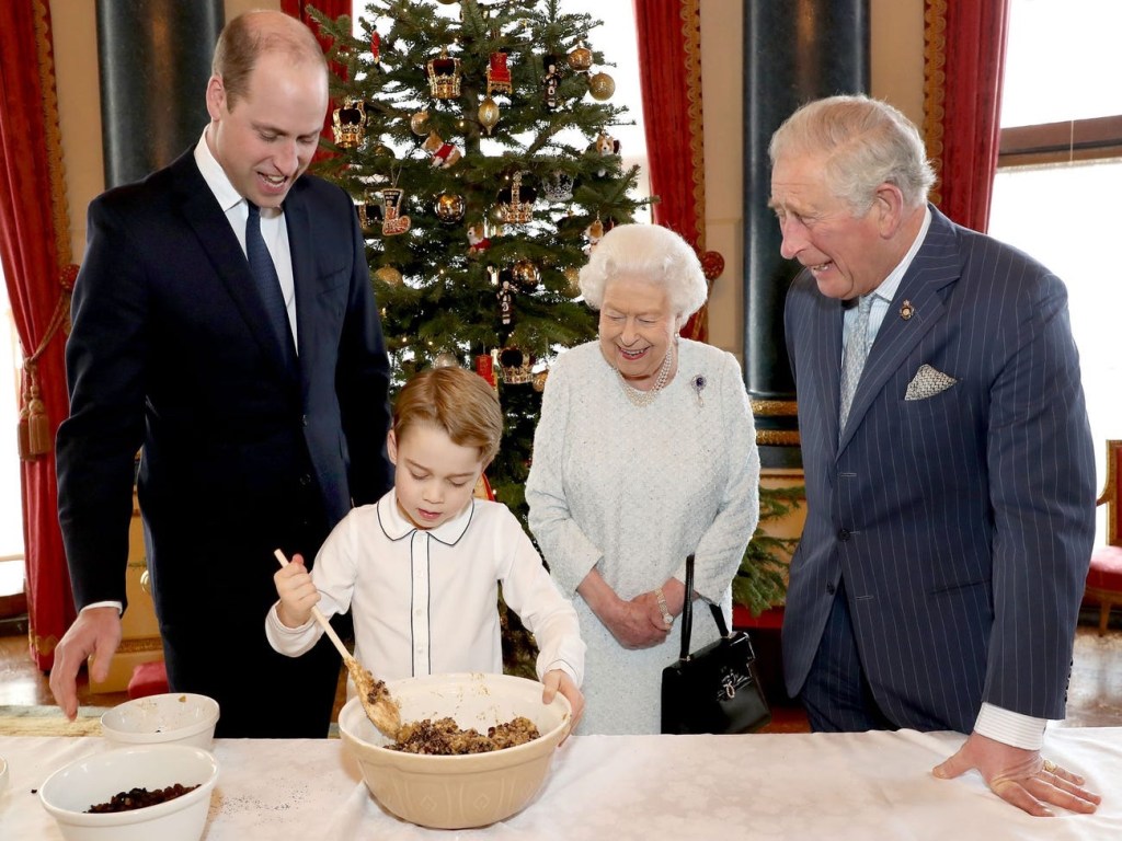 Prince George preparing special Christmas puddings alongside the royal family, 2019.