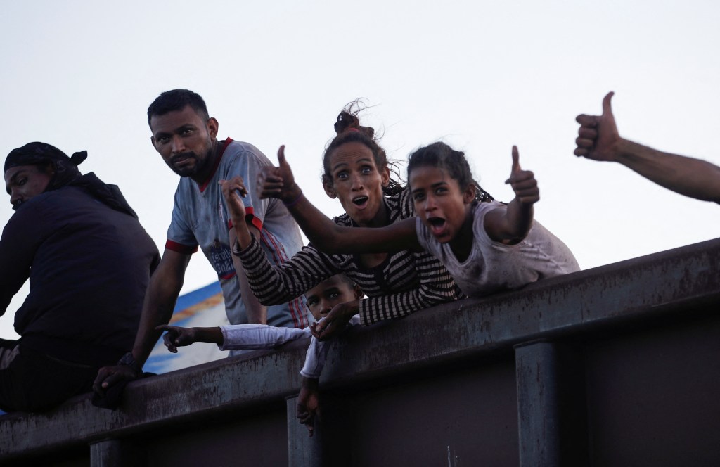 Asylum seekers heading to the U.S. travel on a train after thousands of migrants crossed into the United States in recent days, in El Carmen, Mexico September 21, 2023.