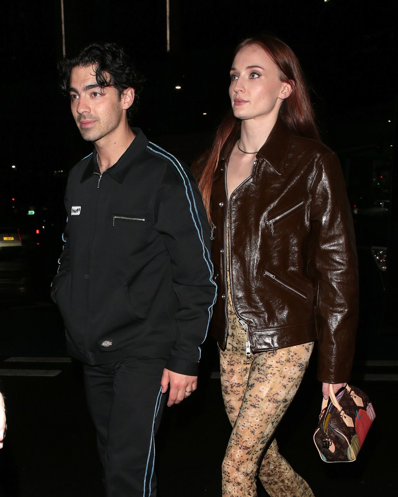 Sophie Turner and Joe Jonas holding hands. 