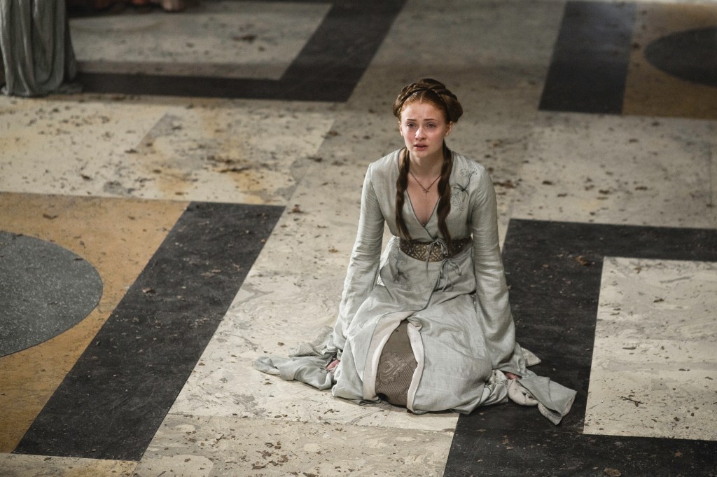 Sansa (Sophie Turner) crying on the ground. 
