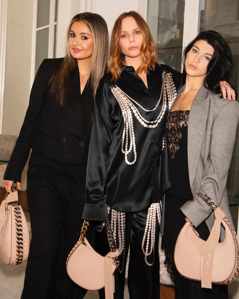 Phoebe Gates and Stella McCartney pose with Gates' business partner Sophia Kianni