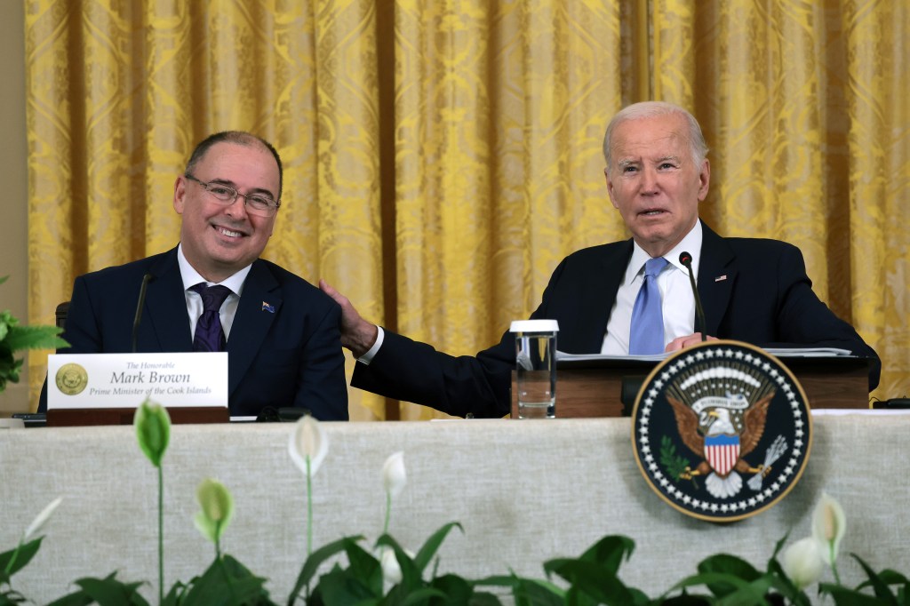 President Biden puts his hand on the shoulder of Prime Minister of the Cooks Islands Mark Brown