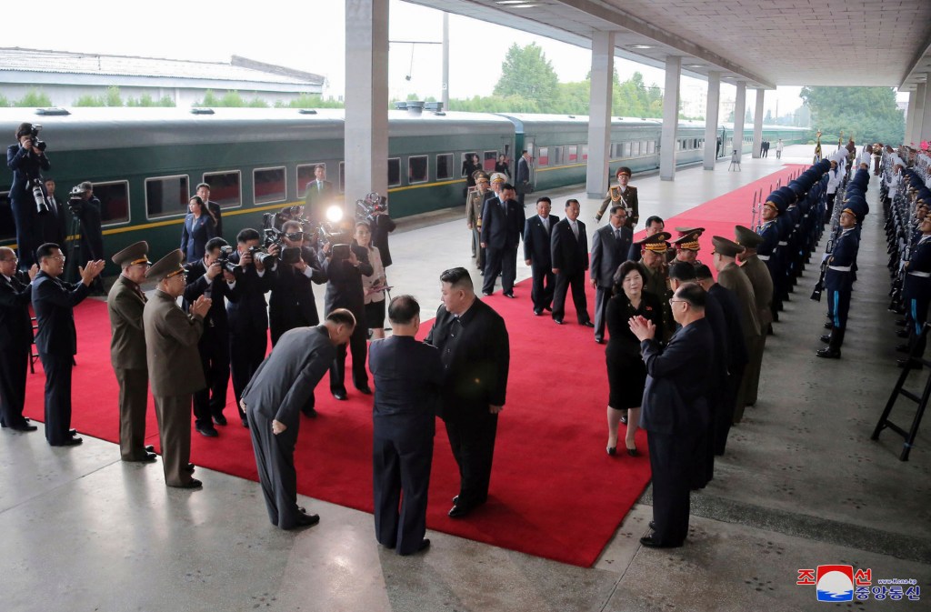 Kim Jong Un greets attendants in Pyongyang, North Korea, before boarding on a train to Russia on Sep. 10, 2023. 