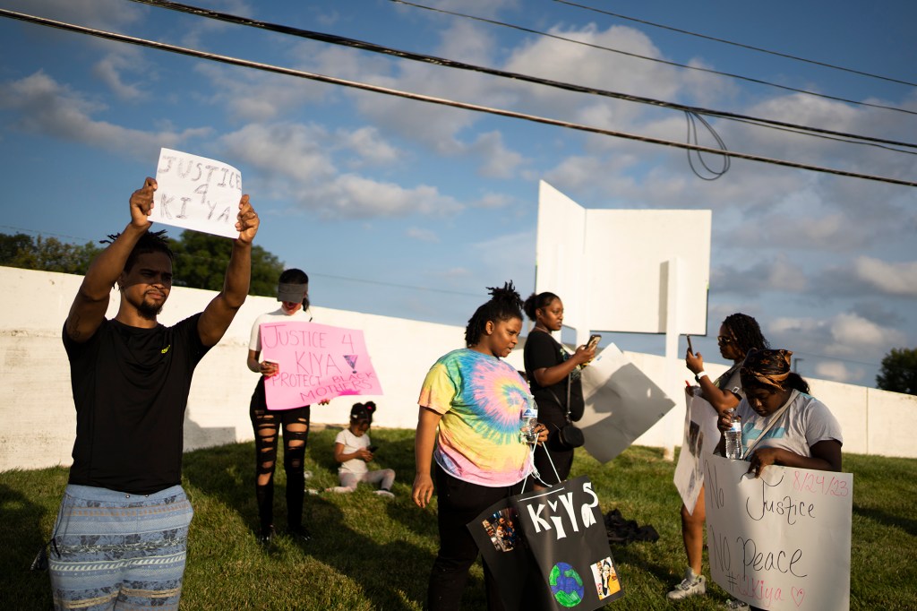 Friends, family and activists gather on Aug. 25, 2023, in Columbus, Ohio, to protest the shooting of 21-year-old Ta'Kiya Young. 