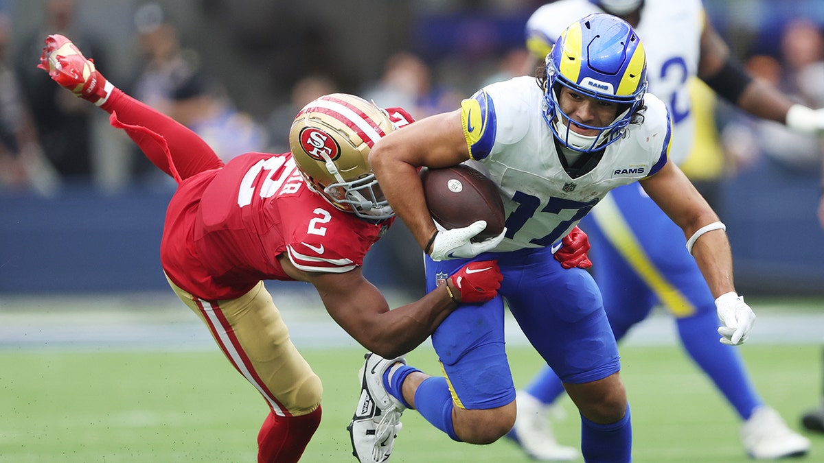 Puka Nacua runs through tackle