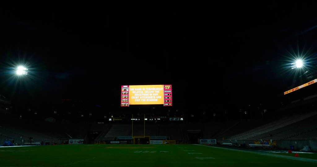 The Arizona State University football stadium displays a weather delay sign during a stop of an NCAA college football game between Arizona State and Southern Utah on Aug. 31, 2023, in Tempe, Ariz. 