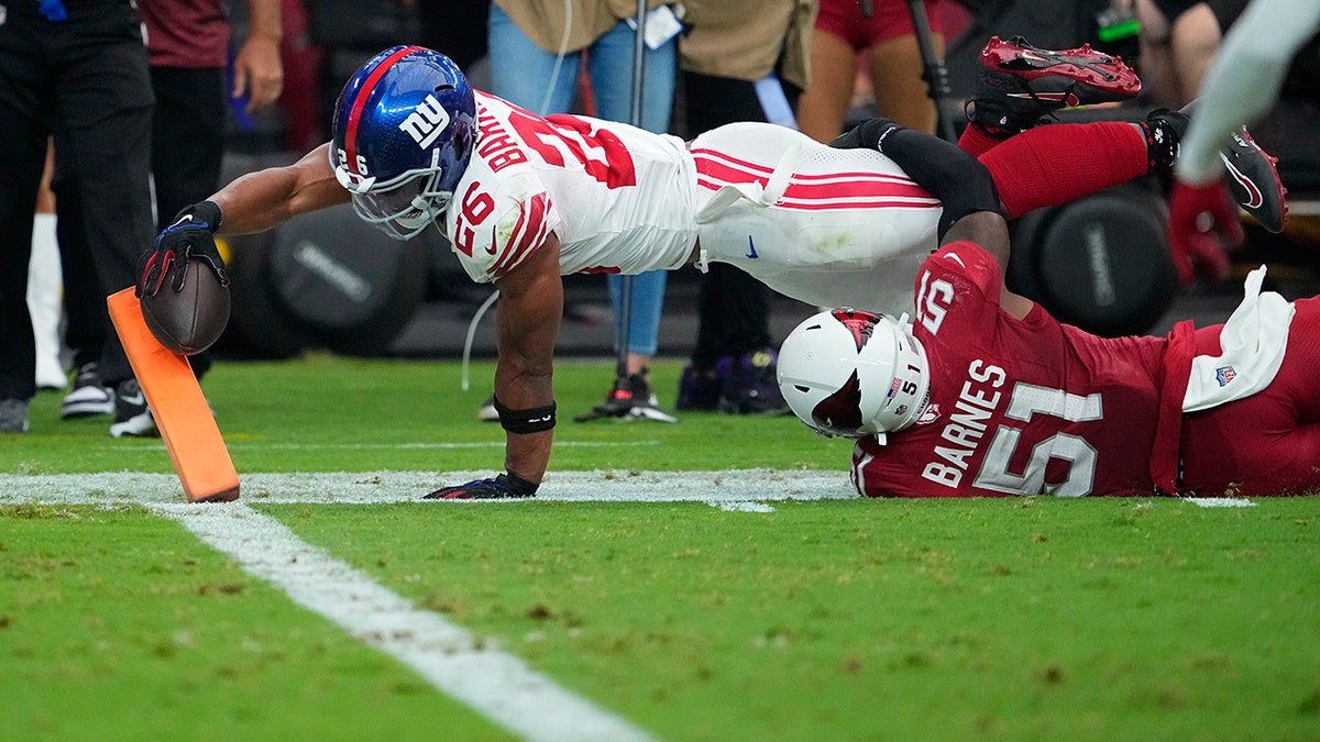 Saquon Barkley dives into the end zone