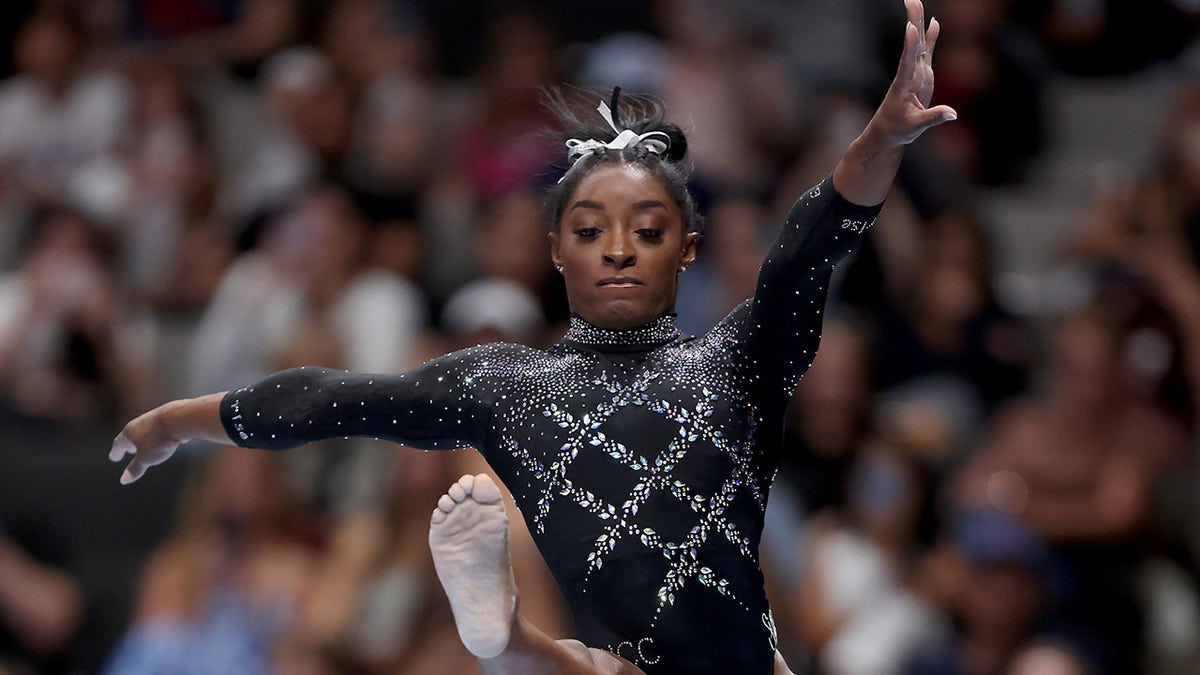 Simone Biles performs on balance beam