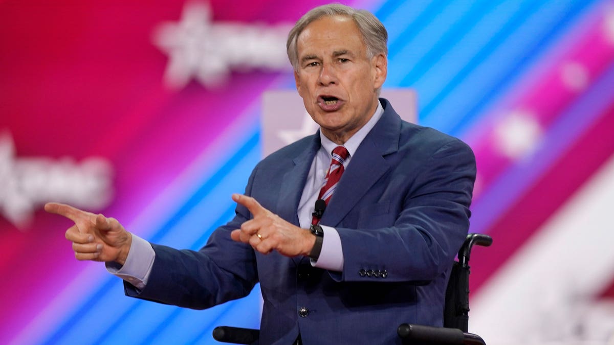 Texas Gov. Greg Abbott on stage speaking at CPAC.