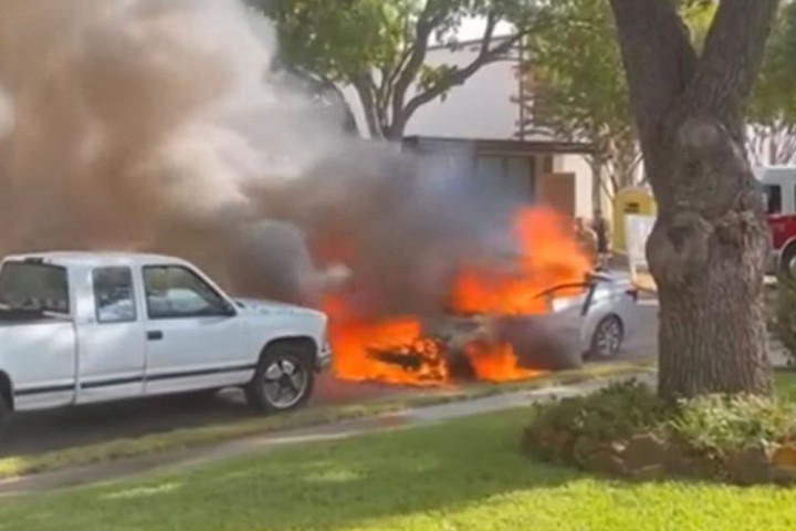 Dennis Brown's flaming car is seen when it suddenly caught fire in Dallas, Texas. 