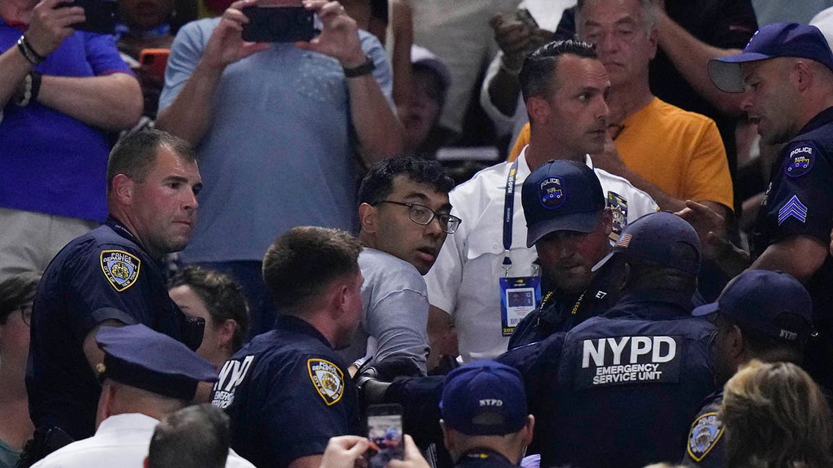 Protester removed from the match