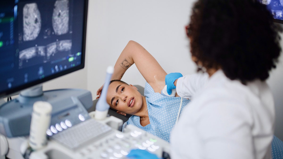 Woman getting mammogram