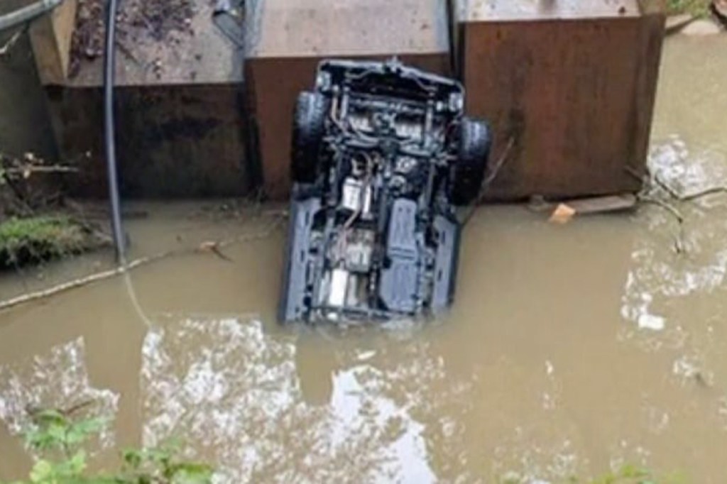 Car sinking into a lake. 